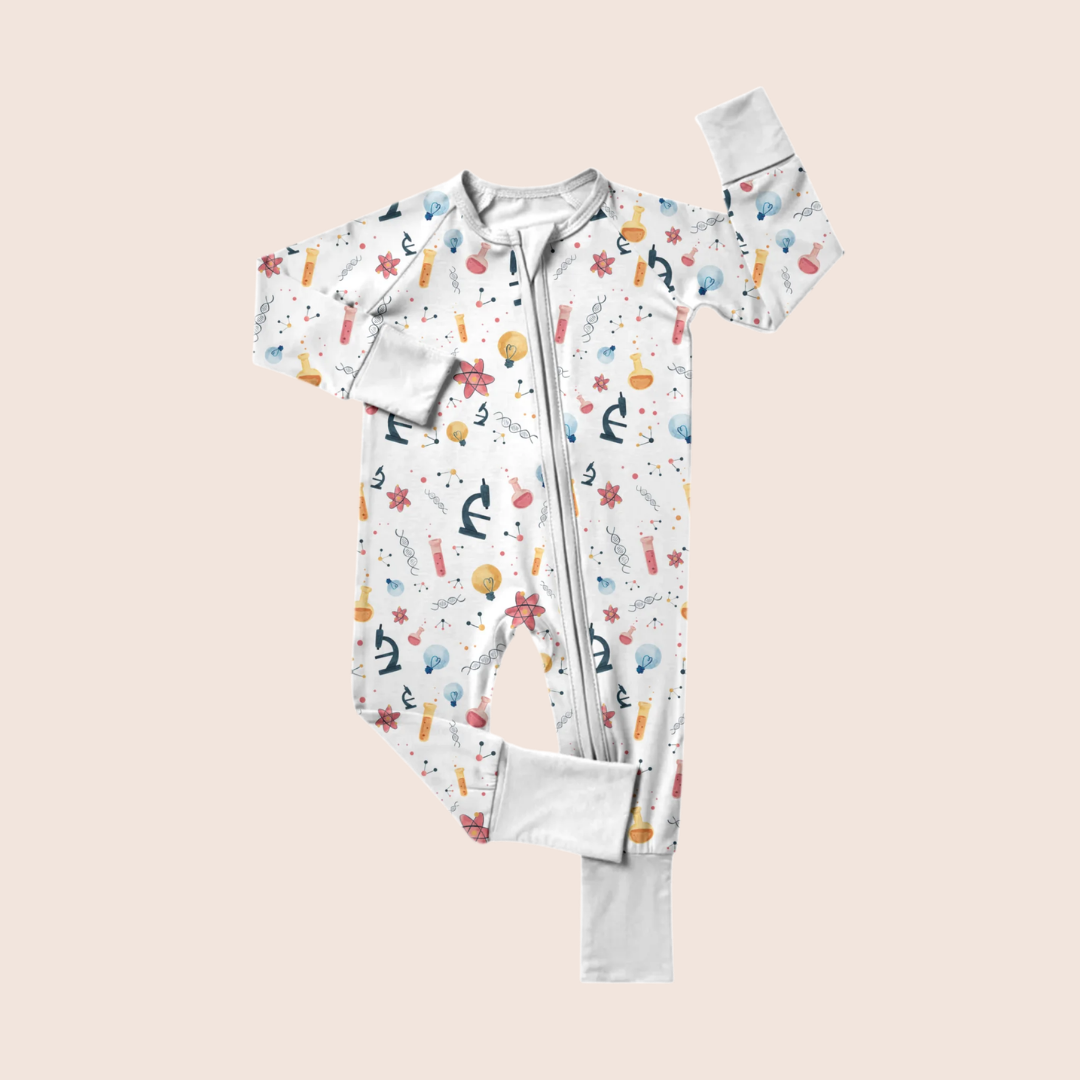 Genetics baby onesie flat lay — organic cotton with DNA helix print