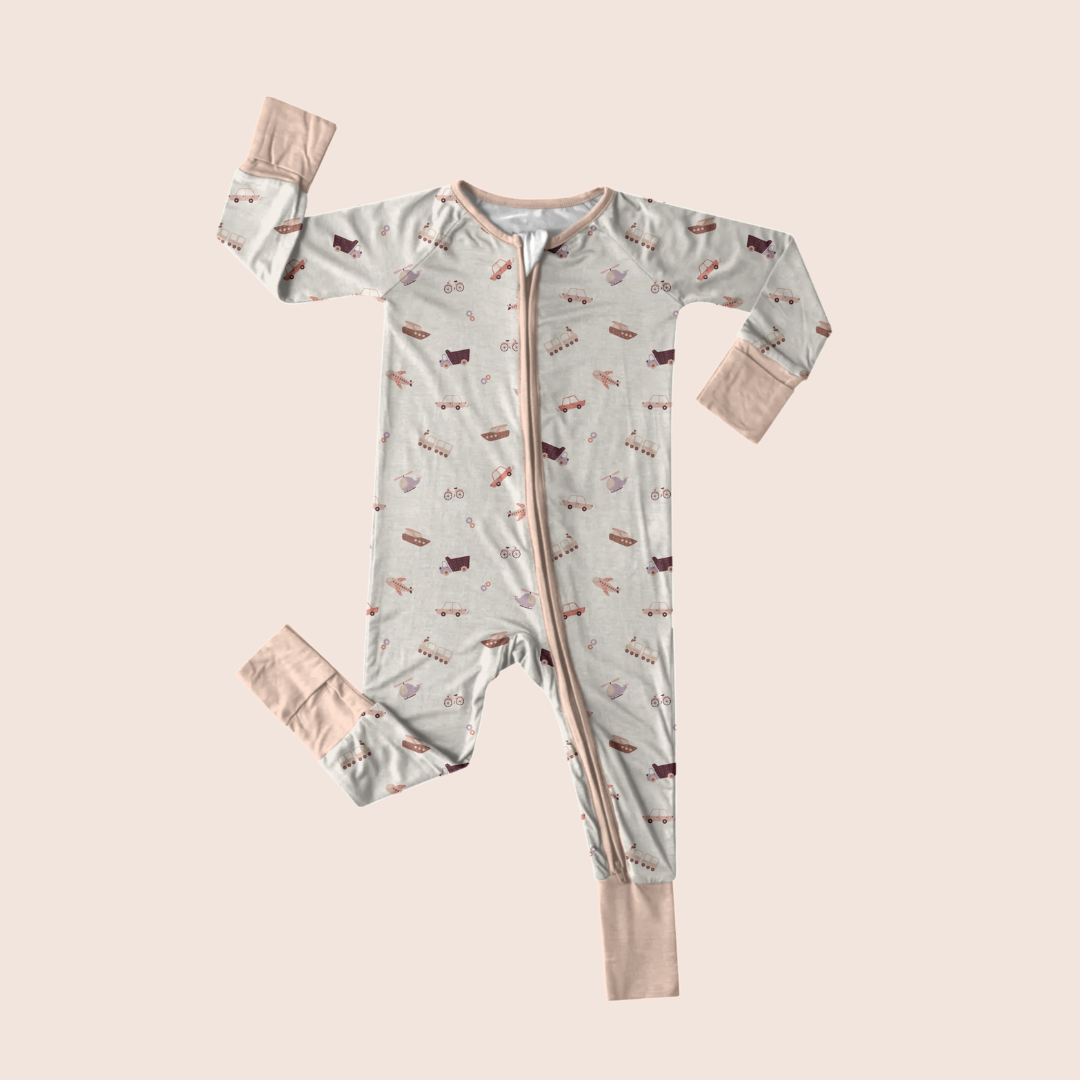Transportation baby onesie flat lay — organic cotton with airplane print