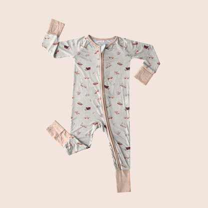 Transportation baby onesie flat lay — organic cotton with airplane print