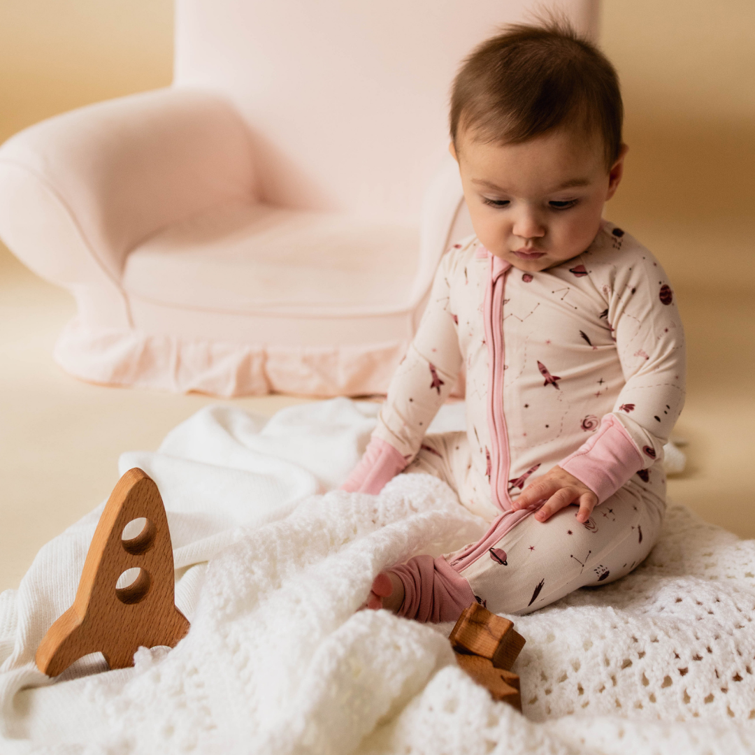 Space-themed baby onesie front view — The Bondar collection by Stemmewear