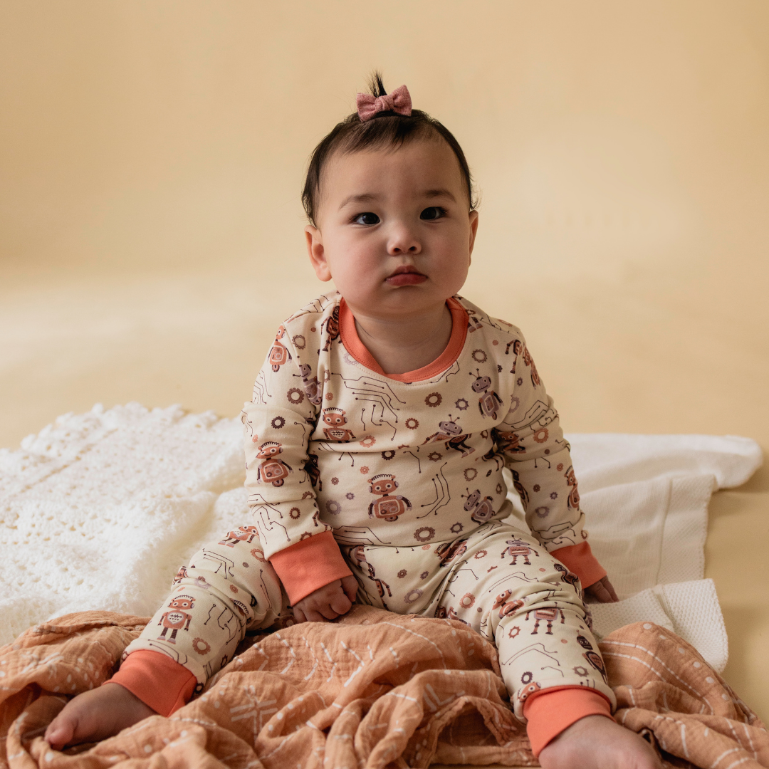 Toddler wearing robot-themed pyjamas — The Lovelace STEM sleepwear