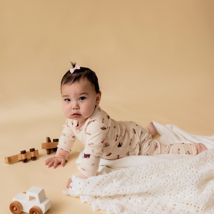 Toddler wearing transportation-themed pyjamas — The Earhart collection