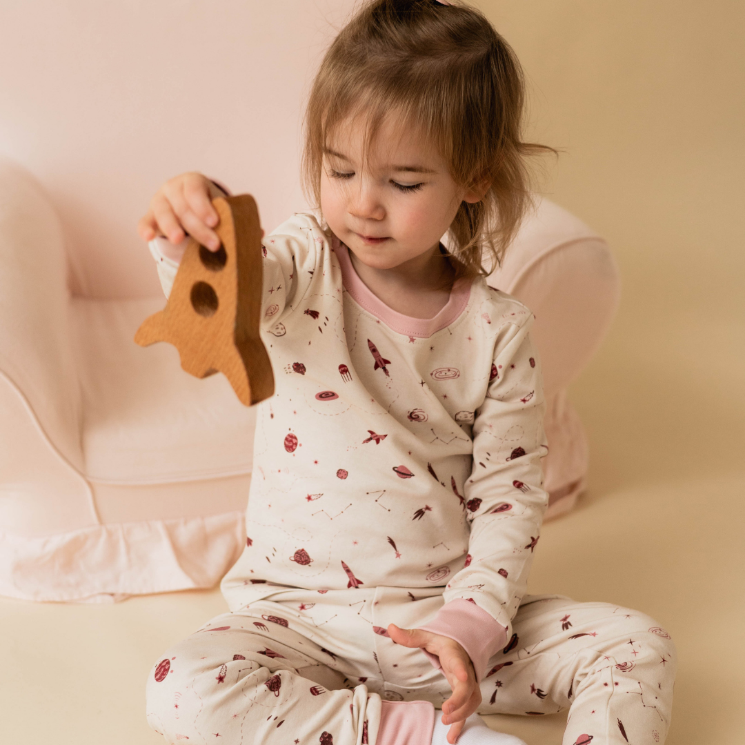 Space toddler pyjamas close-up — constellation print on organic cotton