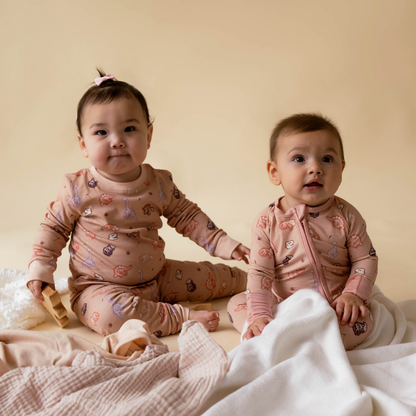 Dinosaur baby onesie fabric detail — 100% organic bamboo cotton